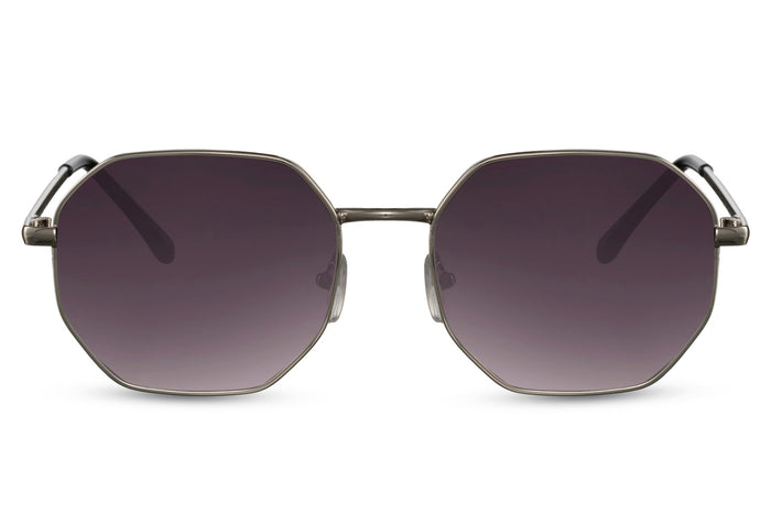 Gafas de sol para mujer Dorelion Aura con montura plateada y detalles en color cobre, lentes negras polarizadas y protección UV400.